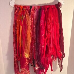 Vibrant sari silk fabric strip Collection in red and orange hues.